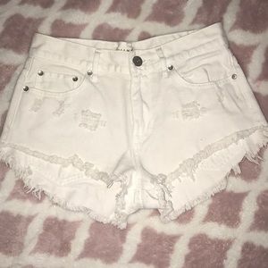 White distressed denim shorts